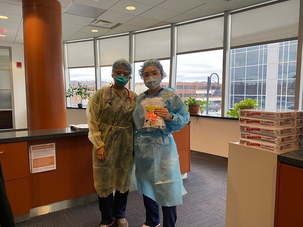 Ashley Hur and coworker in hospital scrubs